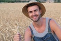 Young cute farmer boy in the fields