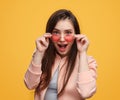 Young woman with sunglasses in studio