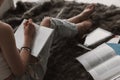 Young Cute Female Student Doing Homework in Bed Royalty Free Stock Photo