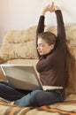 Young Cute Female Student Doing Homework in Bed Royalty Free Stock Photo