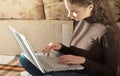 Young Cute Female Student Doing Homework in Bed Royalty Free Stock Photo