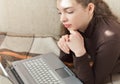 Young Cute Female Student Doing Homework in Bed Royalty Free Stock Photo