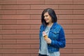 Young cute girl holding an ice cream cone with jam in her hand Royalty Free Stock Photo