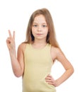 Young cute girl with long light brown hair shows victory sign Royalty Free Stock Photo