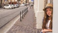 Young cute girl standing in the street old town. Travel. Royalty Free Stock Photo