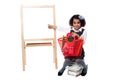 Young cute kid sitting on a pile of books