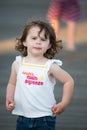 Young cute little girl on the boardwalk looking ahead Royalty Free Stock Photo