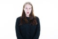Young cute pretty woman in black sweater surprised with open girl mouth in circles on white background