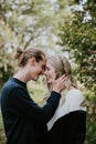 Young Cute Romantic Beautiful Loving Couple Face to Face Looking into Each Others Eyes Outside in Nature Royalty Free Stock Photo