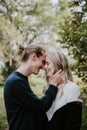 Young Cute Romantic Beautiful Loving Couple Face to Face Looking into Each Others Eyes Outside in Nature Royalty Free Stock Photo