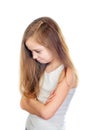 Young cute sad girl with grey blue eyes, long light brown hair and crossed arms Royalty Free Stock Photo