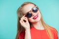 Young cute smiling girl in sunglasses