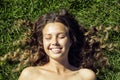 Young cute summer girl on grass outside relaxing