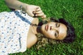 young cute summer girl on green grass outside relaxing smiling, lifestyle people concept Royalty Free Stock Photo