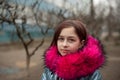 Young woman in blue vegan and faux fur coat is posing on urban city background. Fashion trendy style clothes Royalty Free Stock Photo