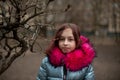 Young woman in blue vegan and faux fur coat is posing on urban city background. Fashion trendy style clothes Royalty Free Stock Photo