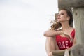 Young cute woman in red monokini on a wooden lifeguard tower Royalty Free Stock Photo