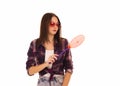 Young cute woman with fly swatter, isolated Royalty Free Stock Photo