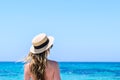 Young cute woman over turquoise sea at tropical beach during vacation Royalty Free Stock Photo