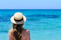 Young cute woman over turquoise sea at tropical beach during vacation Royalty Free Stock Photo