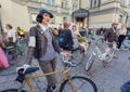 Young cute woman in vintage clothing ready for cycling on old bicycle at fashion festival Retro Cruise Royalty Free Stock Photo