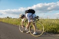 Cycling Tourist Adjusting Bicycle Chain