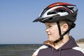 Young cyclist in helmet