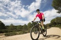 Young cyclist riding a bike across the countryside