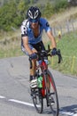 Young cyclo-tourist runs the road of the Tour just before the race