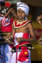A young Cymbal Player or Thalampotakaruwo performs along the streets of Kandy in Sri Lanka during the Esala Perahera.