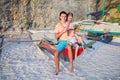 Young dad and his two little girls on a boat at Royalty Free Stock Photo