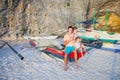 Young dad and his two little girls on a boat at Royalty Free Stock Photo