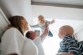 Young dad play with daughter throws up and hold her in hands Royalty Free Stock Photo