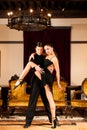 Young dance couple preforming latin show dance in ancient ballroom Royalty Free Stock Photo