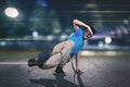 Young dancer doing break dance on the road Royalty Free Stock Photo