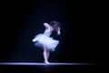 Young dancer with motion blurred in blue light