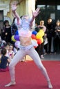 Joyful Expressions: Young Dancer\'s Enchanting Performance on the Public Stage