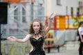 Young dancer in traditional dress, young woman dancing arabic dance, street group. The girl is dancing in public. The girl in