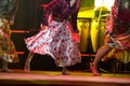 Young dancer woman barefoot in gypsy dress dancing on stage Royalty Free Stock Photo