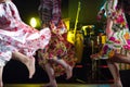 Young dancer woman barefoot in gypsy dress dancing on stage Royalty Free Stock Photo