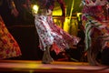 Young dancer woman barefoot in gypsy dress dancing on stage Royalty Free Stock Photo