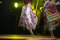 Young dancer woman barefoot in gypsy dress dancing on stage Royalty Free Stock Photo