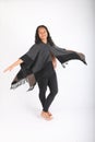 Dancing pregnant woman in grey poncho Royalty Free Stock Photo