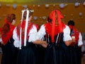 Young dancing women in traditional folk dress on wedding feast ceremony.