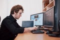 The young dangerous hacker breaks down government services by downloading sensitive data and activating viruses. A man