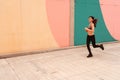 Beautiful Young dark haired athlete woman doing sprint sprinting outdoors. Concept of full life, natural and healthy life. Women` Royalty Free Stock Photo