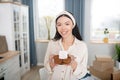 Young dark-haired girl with a saucer of gluten-free cookies.