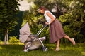 Woman walking with stroller Royalty Free Stock Photo