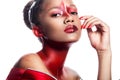 Young dark-skinned girl with abstract asymmetric red make-up Royalty Free Stock Photo