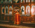 A young deacon censes the censer before the altar at the divine Liturgy in the Orthodox Church Royalty Free Stock Photo
